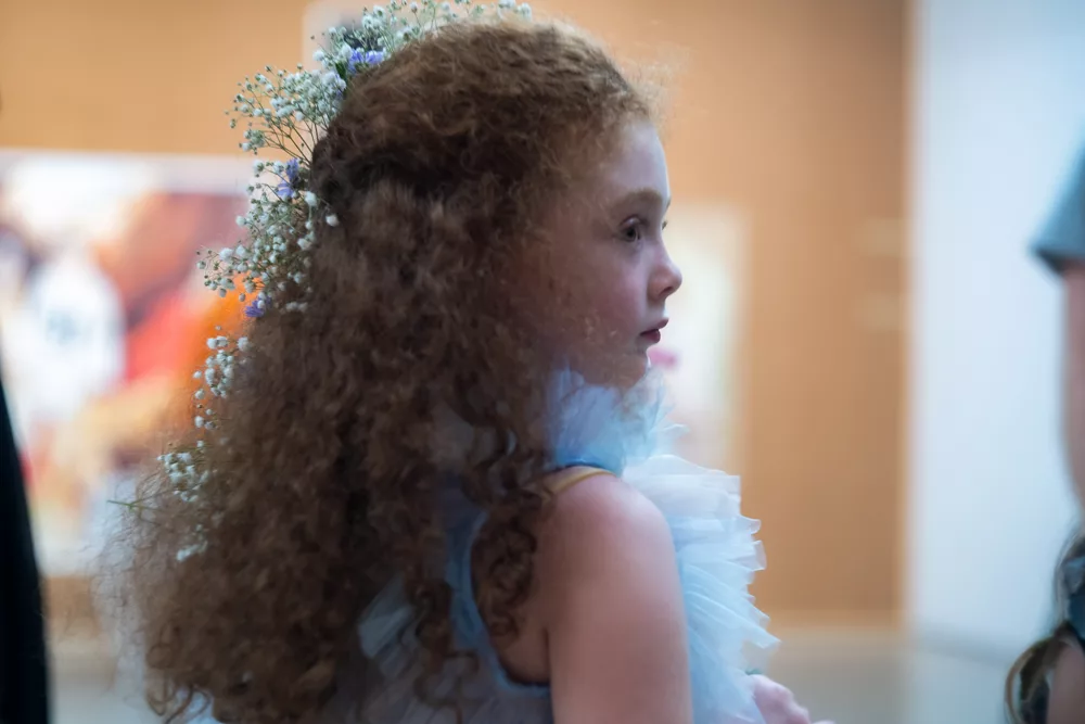 Tara Subkoff's IoC profile of young girl with flowers in her hair