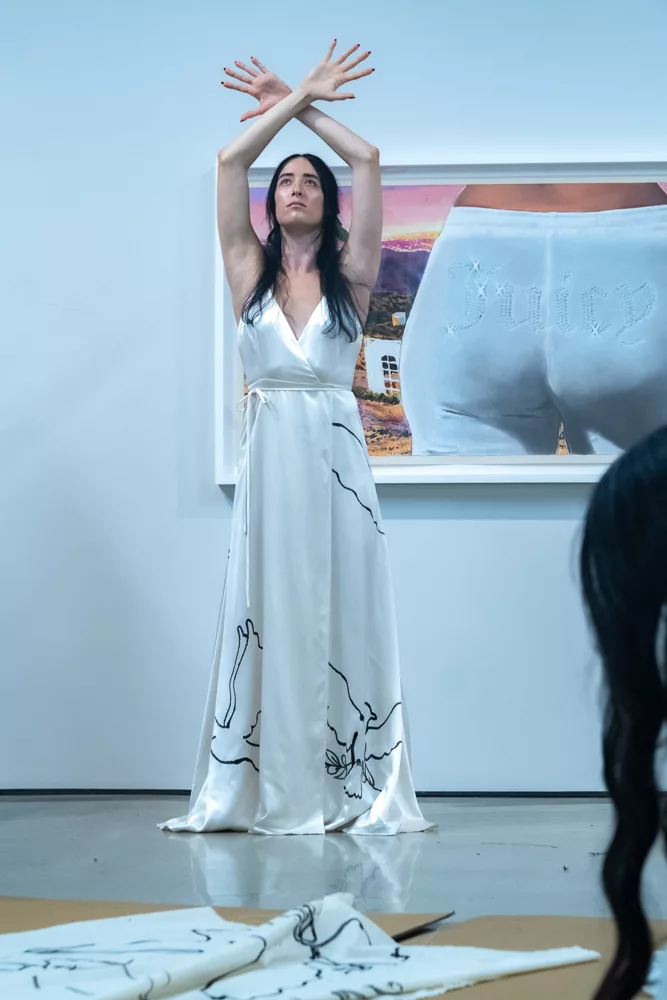 Tara Subkoff's IoC woman in white dress with doves