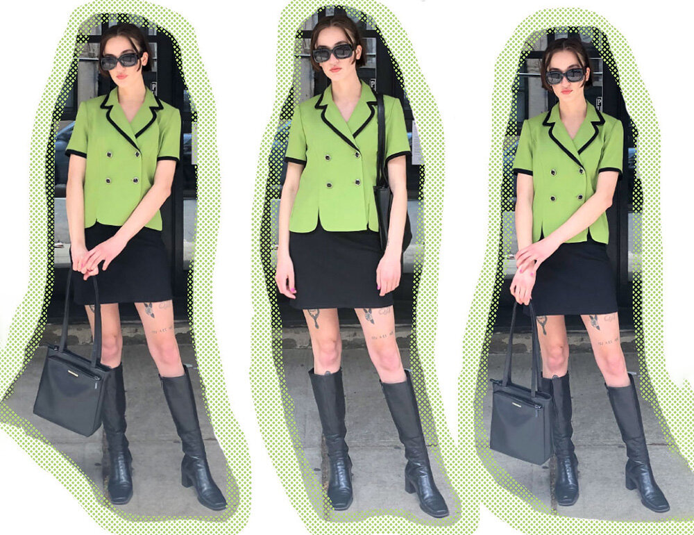 A black mini skirt and black accessories to match the black piping on the green top.&nbsp;