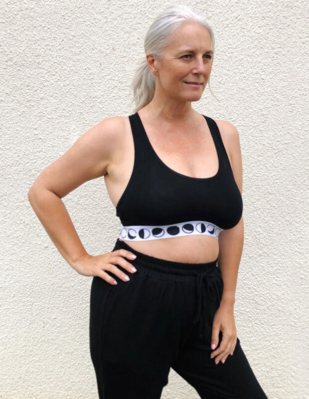 Woman wearing Miakoda sports bra and sweatpants