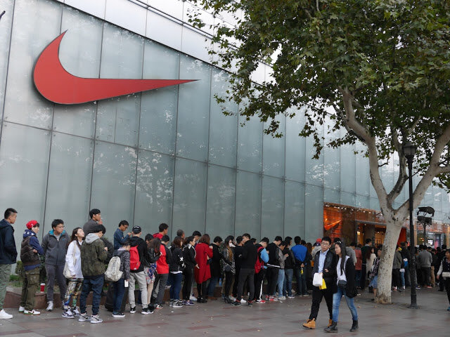 Sneakerheads are international: this is a line outside of Nike in Shanghai waiting for a limited edition drop.
