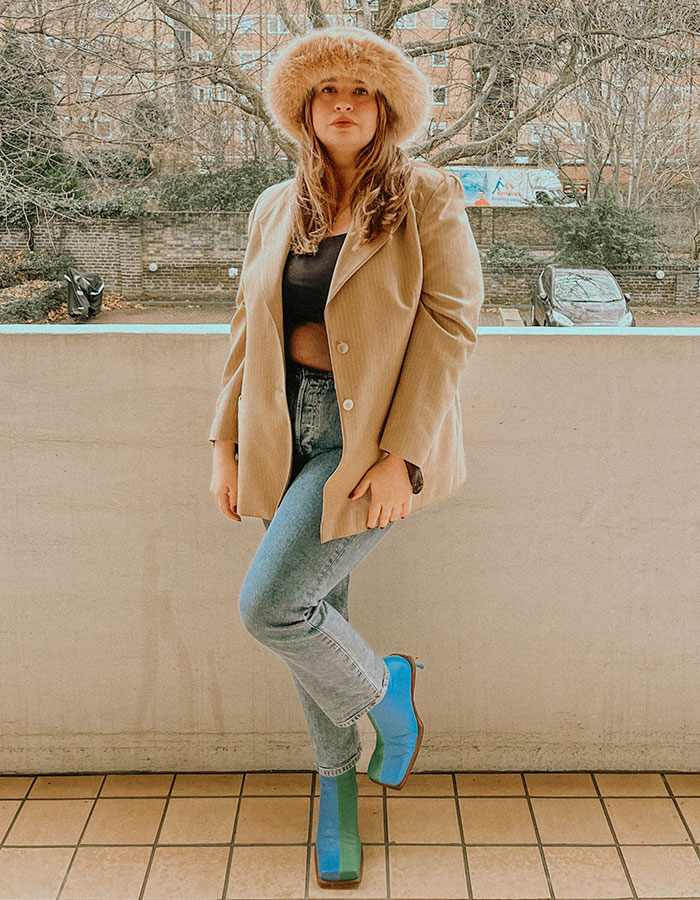 styling a camel blazer with blue boots