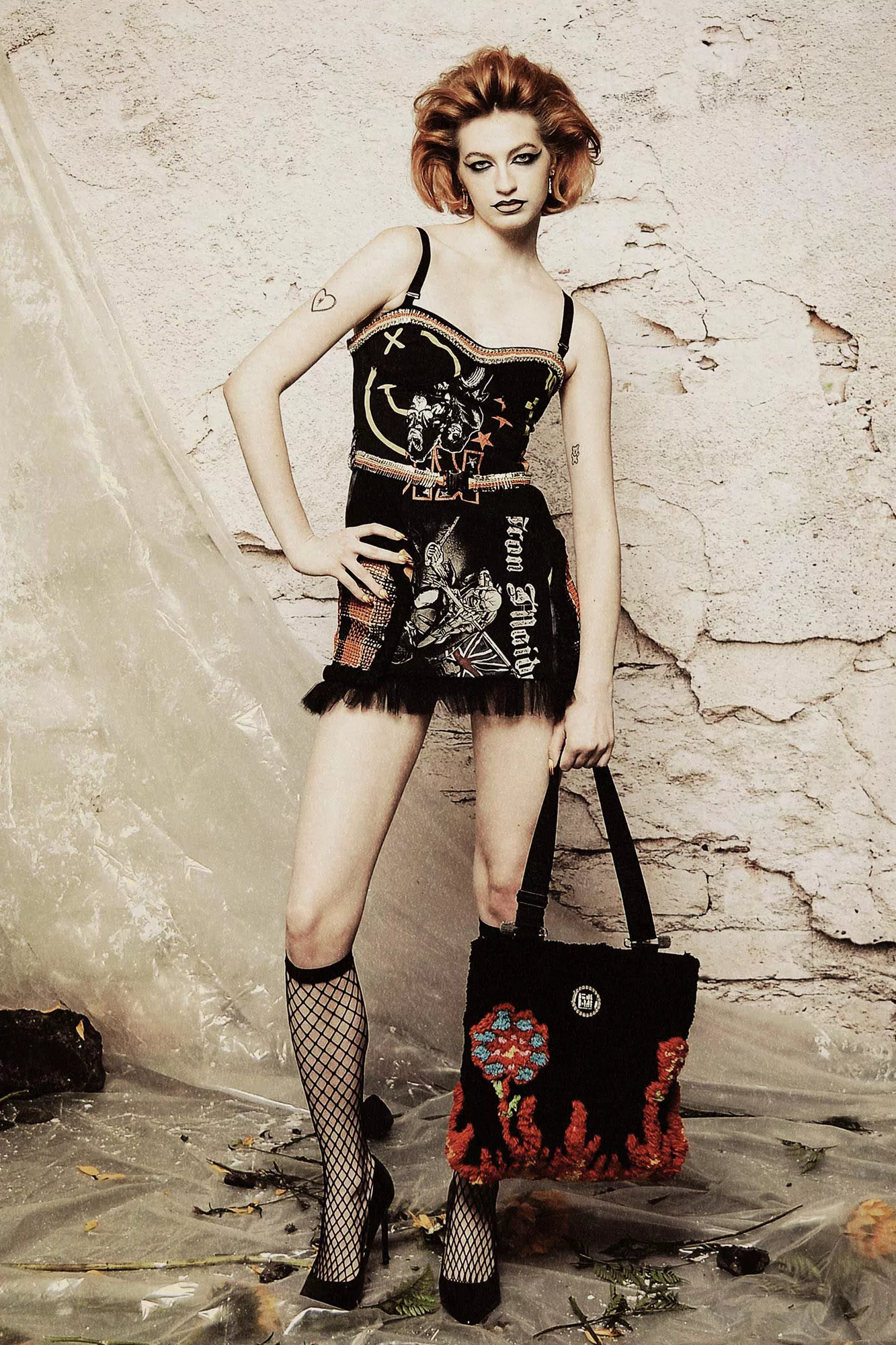 woman in corset and miniskirt made from rock concert t-shirts by tara babylon