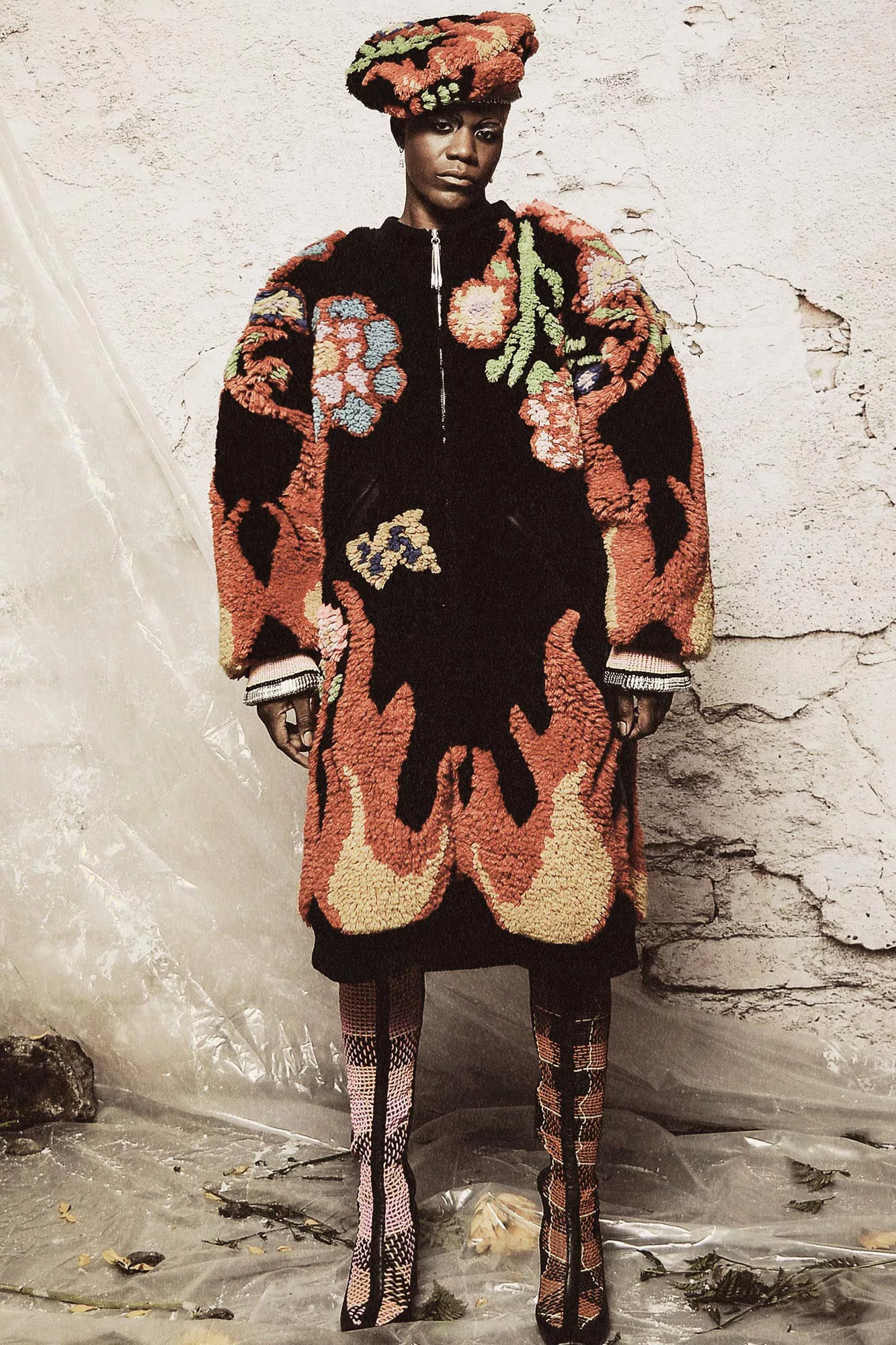 man wearing carpet coat of flames and flowers