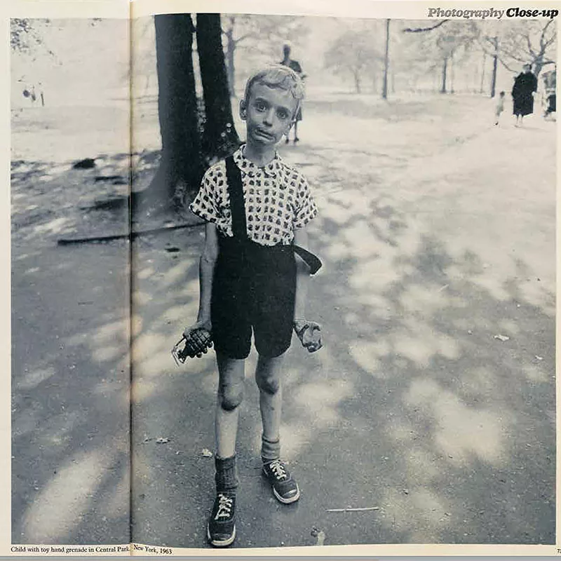 Child with toy hand grenade in Central Park 1963 by Diane Arbus photographer 