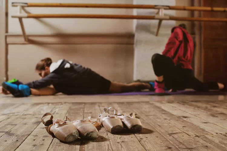 dancer stretching in a studio