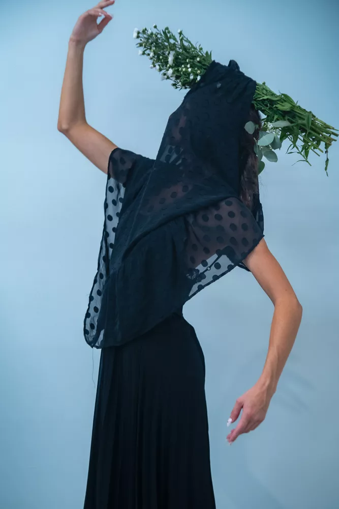 Tara Subkoff's IoC woman in black dress