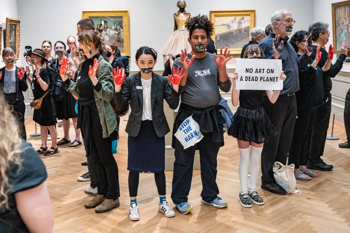 climate protestors at the MET museum by the Degas statue