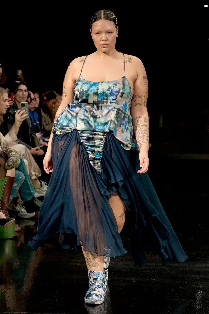 plus size woman wearing a corset and skirt on collina strada fw24 runway