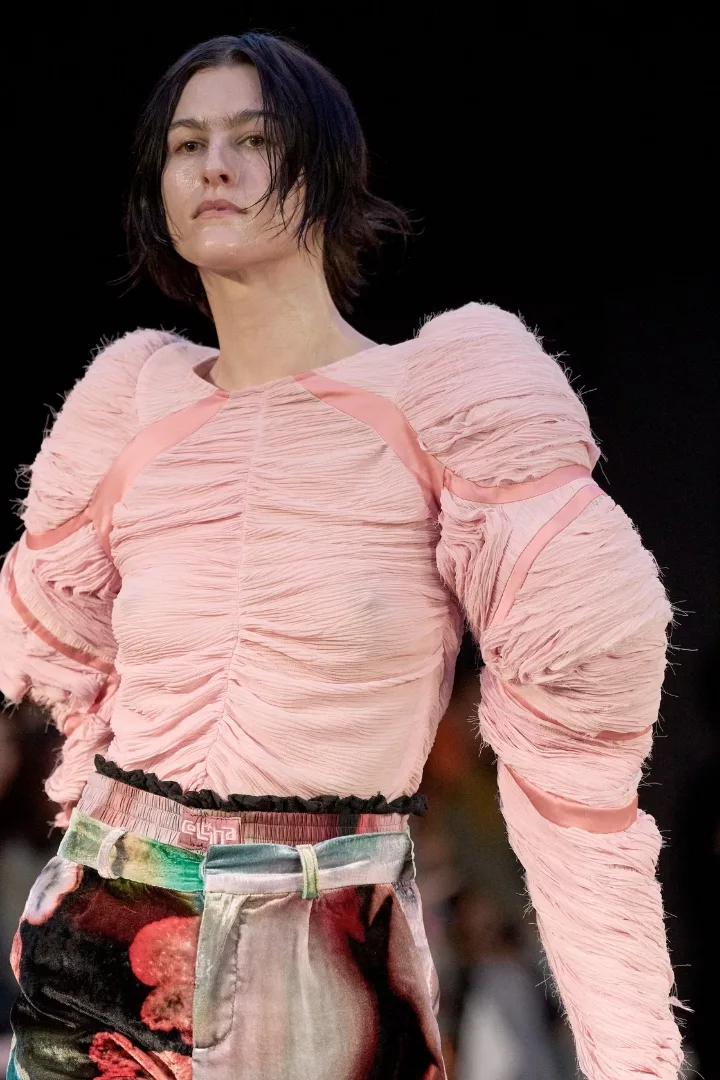 woman wearing a pale pink padded shirred top on collina strada fw24 runway