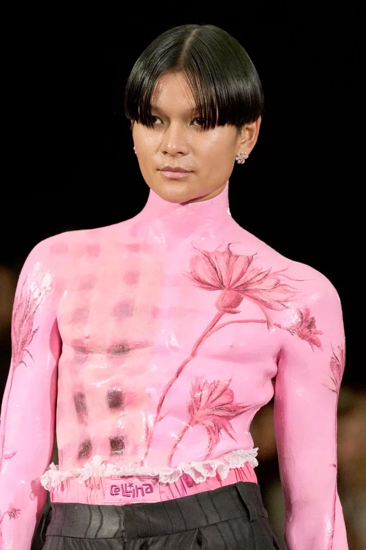 woman wearing a pale pink top on collina strada fw24 runway